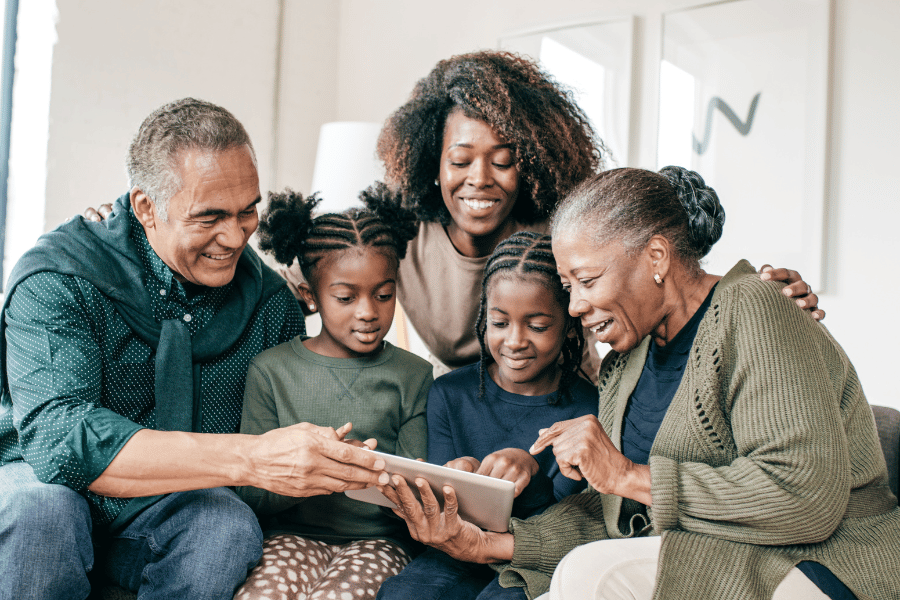 African American family looking at tablet